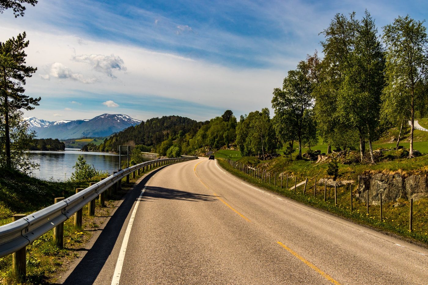 A road winding along a lake