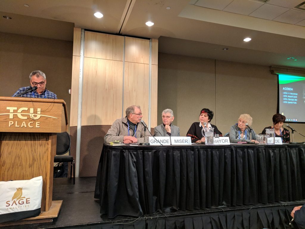 SUMA delegates seated at a panel table during a meeting simulation